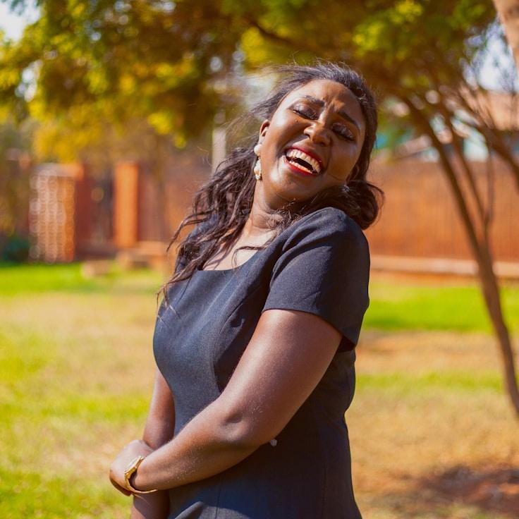 A. Patel, Lead Design Curator at linenMarshQuill, reviewing corporate floral arrangements